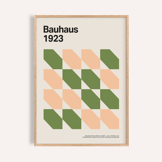Framed close-up of Mid Century art prints with green and peach geometric shapes in Bauhaus style