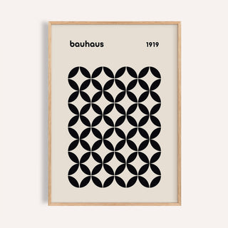 Mid Century Wall Print showing a black geometric grid in a natural wood frame on a pale wall