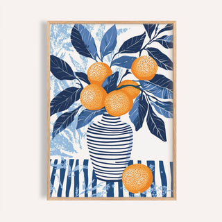 Framed print of oranges in a striped vase with blue leaves and an abstract background