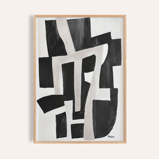Framed print of abstract black and white shapes in a minimalist style