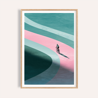 Framed print close-up of minimalist cycling art print with a cyclist on a curved pink and blue path