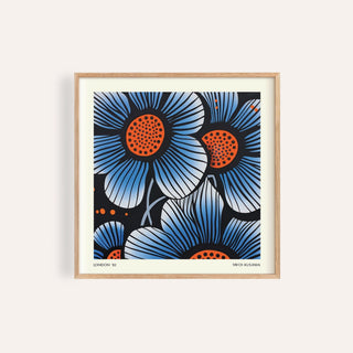 Framed Blue Flower wall art with large blue and orange pop-art style flowers