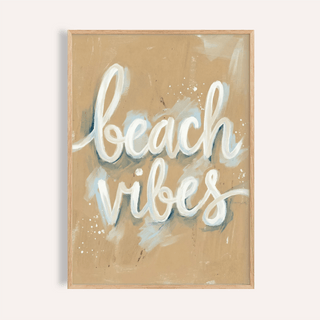 Framed print close-up of Beach Vibes wall art with white text and beige abstract background