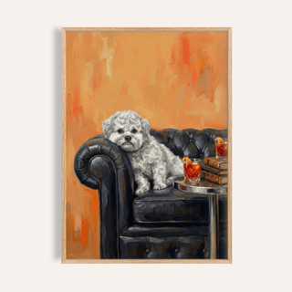 Framed print of dog with human face on a black leather sofa with an orange background
