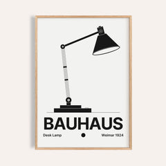 Lamp poster of a jointed desk lamp with a black cone shade and BAUHAUS wordmark
