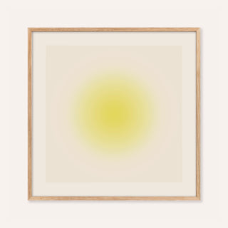 Yellow wall art with a soft butter yellow orb on a warm cream square