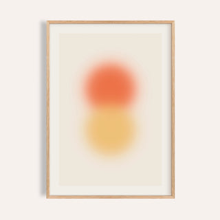 Orange and yellow wall art with a tangerine orb stacked above an amber orb