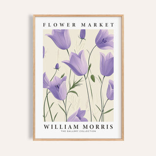 Framed print of purple bell flowers with green stems and text on a cream background