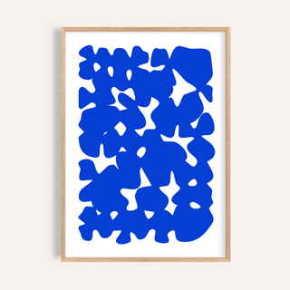 Framed print of modern abstract art with bold blue shapes on white background