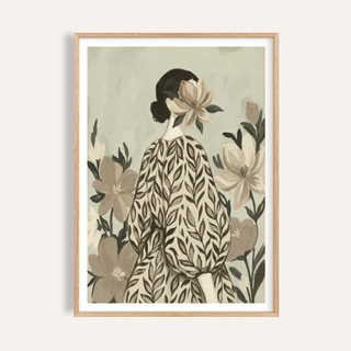 Framed print of a woman in a leafy dress with large flowers in muted greens and browns