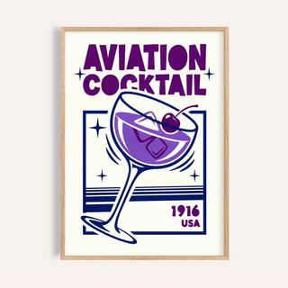 Framed Aviation Cocktail Print showing a purple cocktail glass with a cherry and typographic style