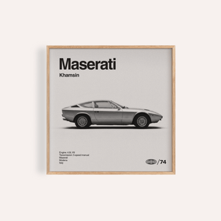 Classic 1970s Grand Tourer poster in light wood frame with silver car and black text on grey background