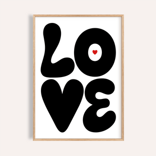 Framed print close-up of a minimalist typographic love illustration with black letters and red heart