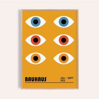 Eye Poster of stylized blue orange and red eyes in a minimalist bauhaus style in a light wooden frame