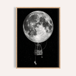 Framed print close-up of Moon Hot Air Balloon Art with black background and an astronaut hanging from the basket