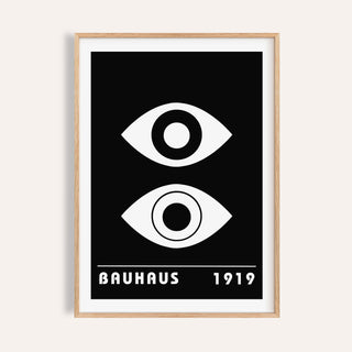 Framed Eye Art with two abstract eyes in black and white and bauhaus text