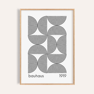 Framed Bauhaus wall art featuring black concentric semicircles and text on white background