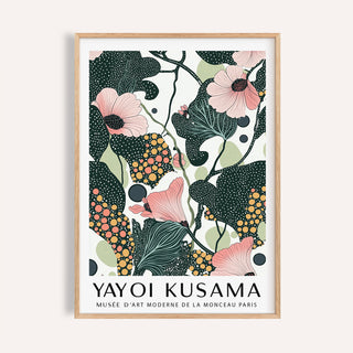 Framed close-up of wall art with pink flowers and dark green leaves with text below