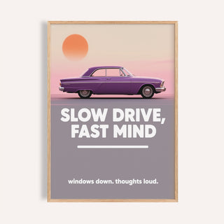 Framed vintage car wall art featuring a purple car and bold white typography