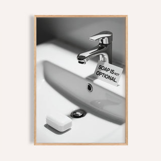 Wash Hands Sign framed print of a minimalist bathroom sink with a bar of soap and a sign