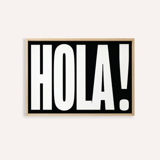 Framed print close-up of bold HOLA typography in black and white