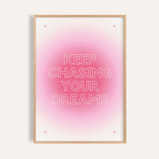 Framed print of motivational text with pink gradient and star details