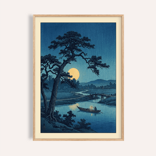 Framed print of moonlight print showing a moonlit river with a boat and large tree in blue tones