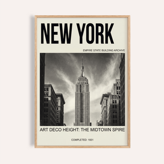 Framed close-up of Empire State Building wall art showing black and white photo with typography