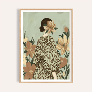 Framed close-up of Woman With Flowers artwork showing a woman with a leaf patterned dress and large flower headpiece