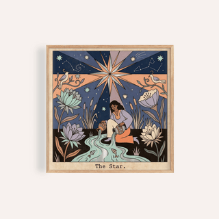 Framed print of The Star Tarot Card Art showing a woman pouring water under a large star with birds and flowers
