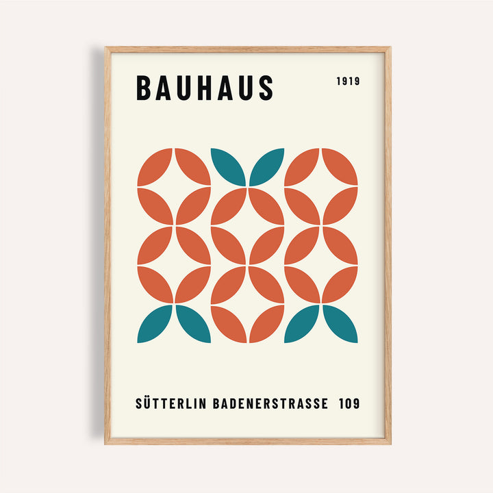 Framed print of Bauhaus modern geometric wall art with teal and rust shapes in a minimalist style