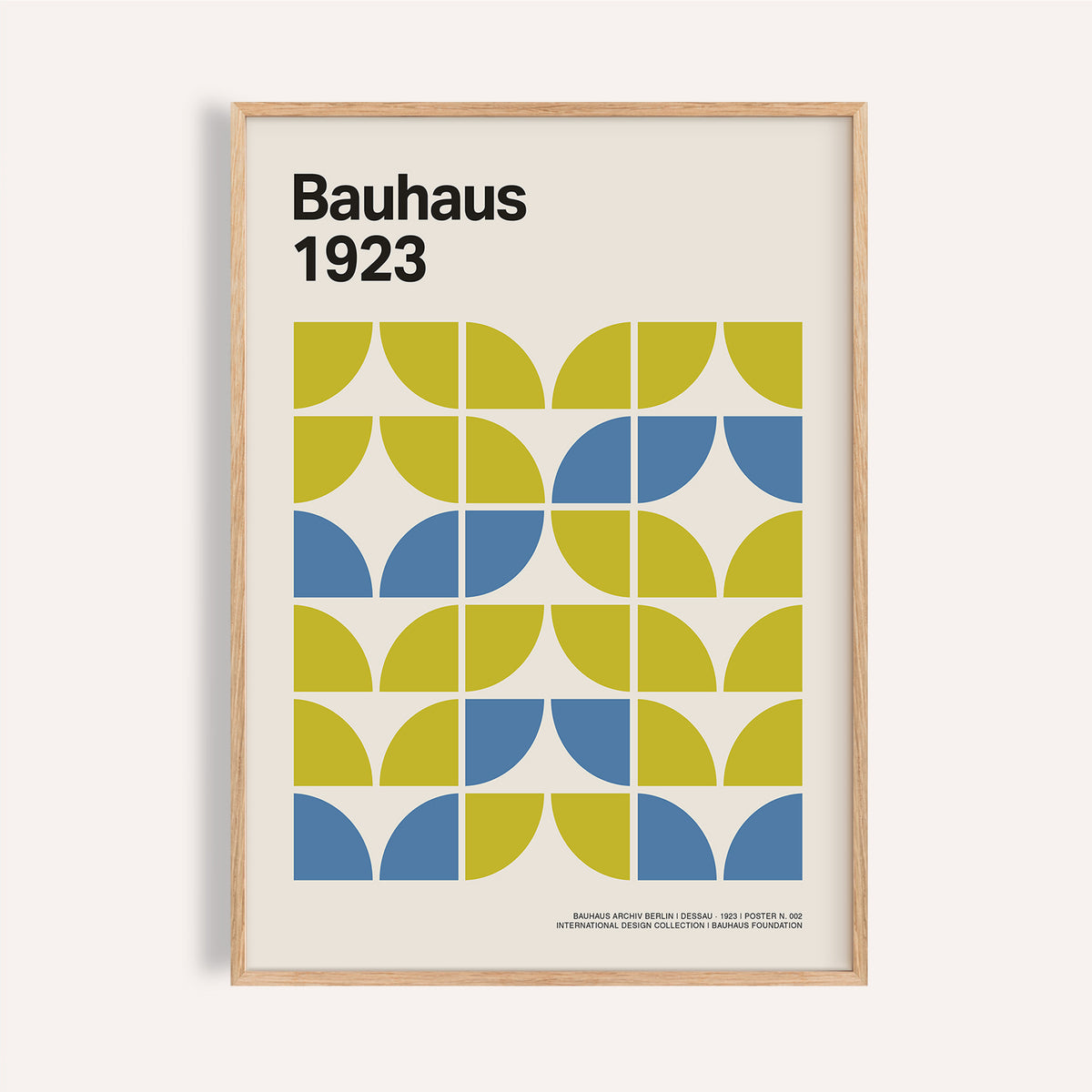 Framed Bauhaus Geometric Art with lime green and blue blocks on a cream background