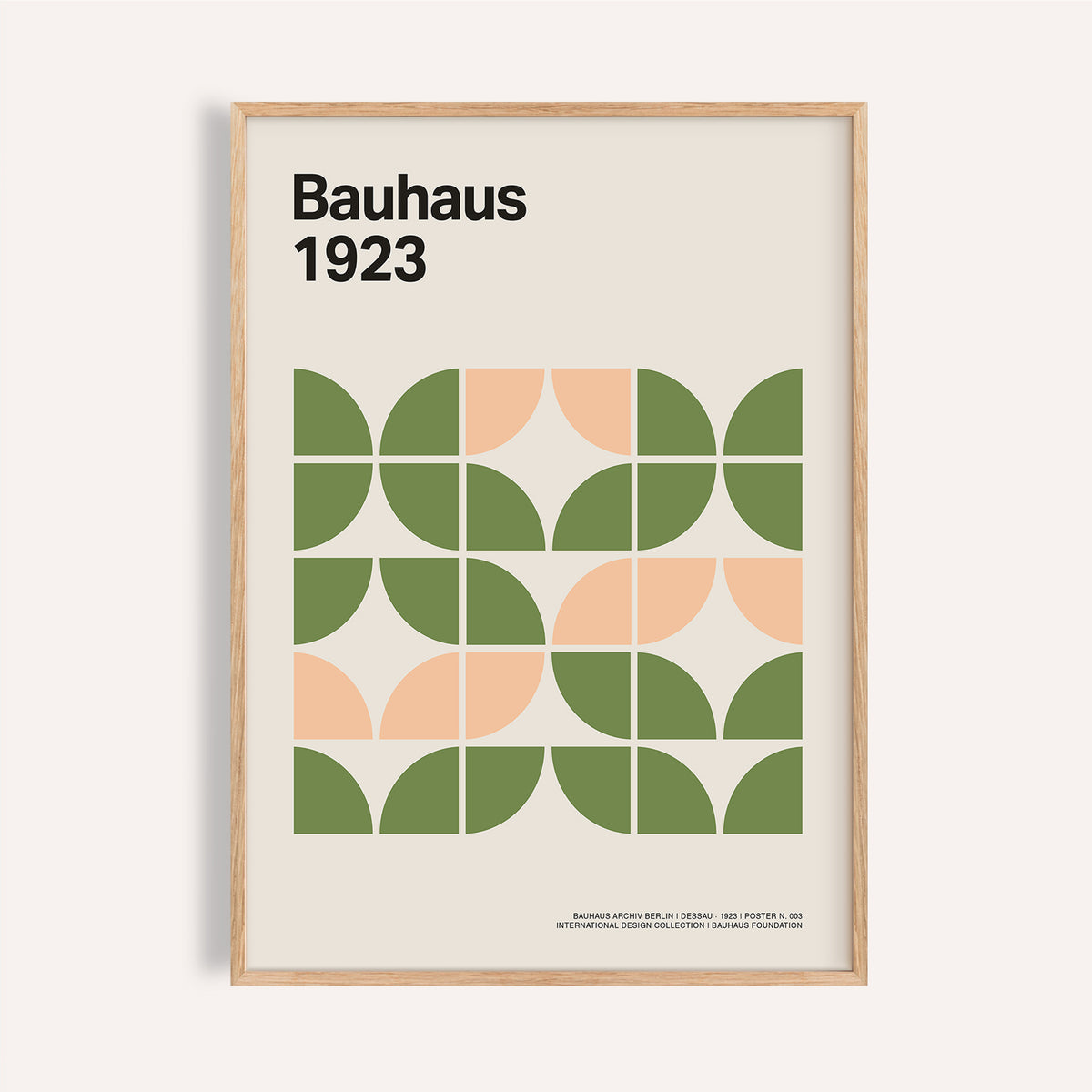 Framed Mid Century Modern wall art with green and peach geometric shapes