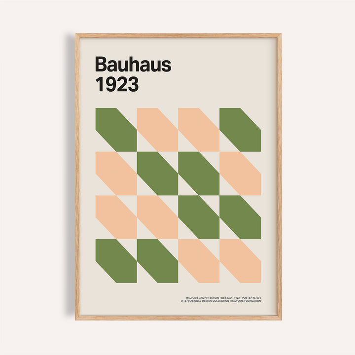 Framed close-up of Mid Century art prints with green and peach geometric shapes in Bauhaus style