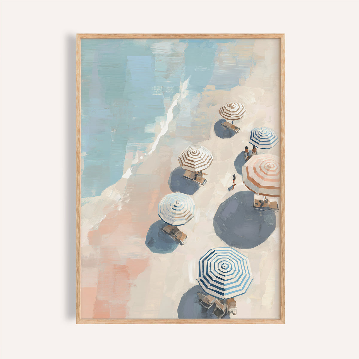Framed beach umbrella print close-up showing striped umbrellas with blue and beige tones