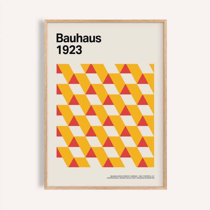 Framed print close-up of geometric triangles in yellow and red with text Bauhaus 1923