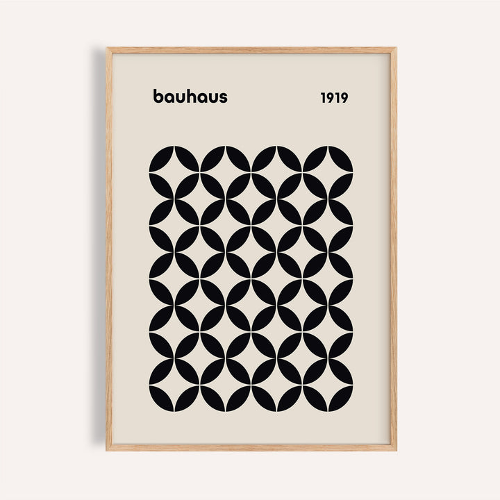Mid Century Wall Print showing a black geometric grid in a natural wood frame on a pale wall