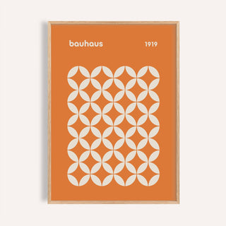 Framed orange poster with a white circle grid in bauhaus style and text 1919