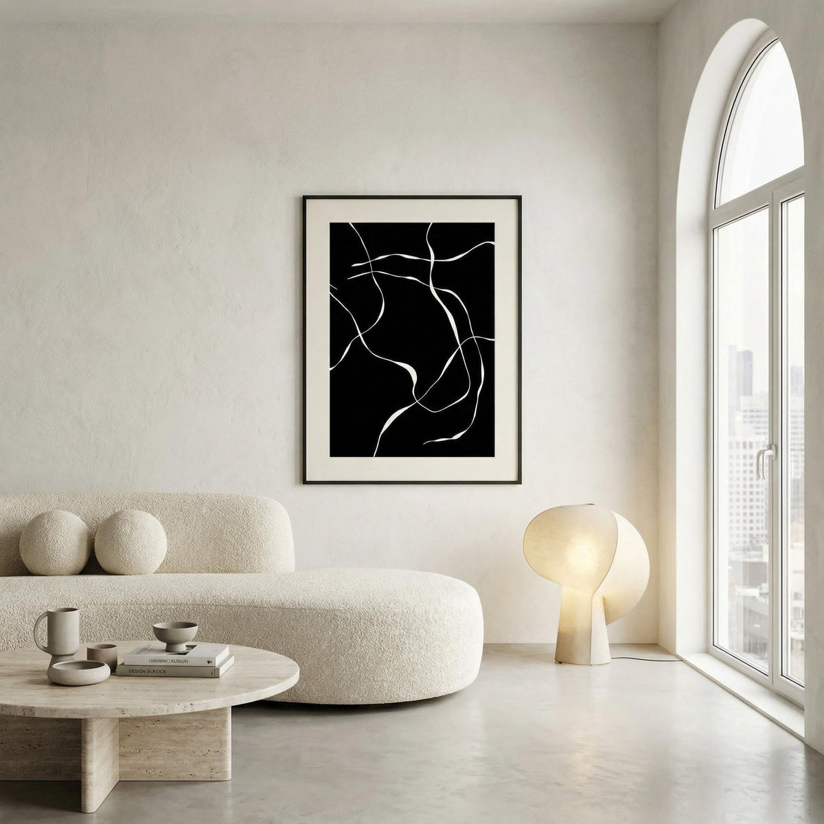 Abstract Lines Art Print on a wall with white abstract lines in black frame in a neutral lounge with round lamp