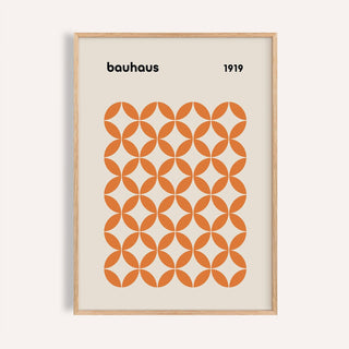 Framed close-up of orange minimalist print with bauhaus style and orange circle pattern