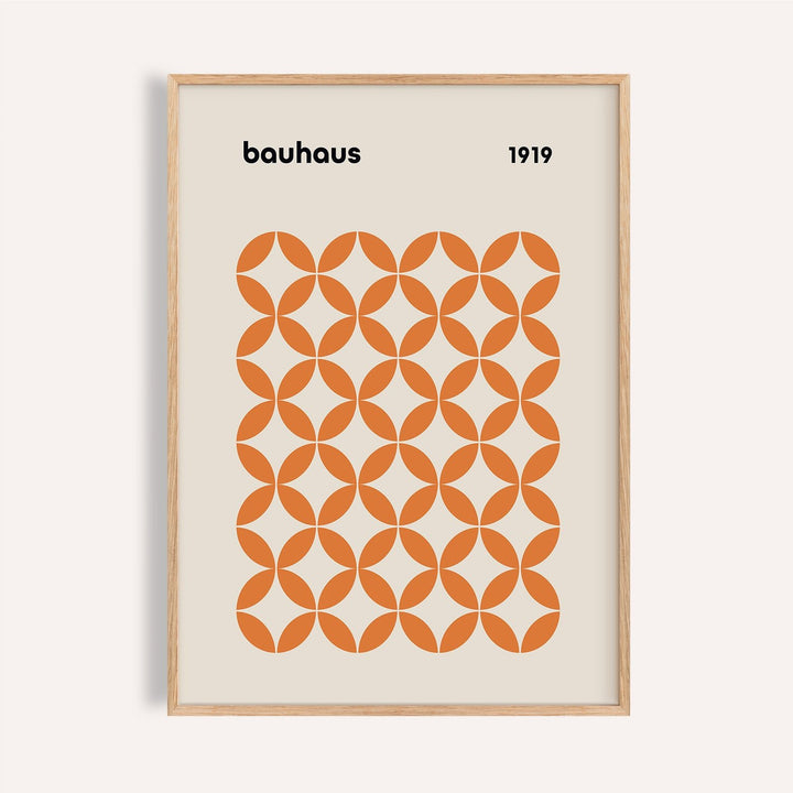 Framed close-up of orange minimalist print with bauhaus style and orange circle pattern