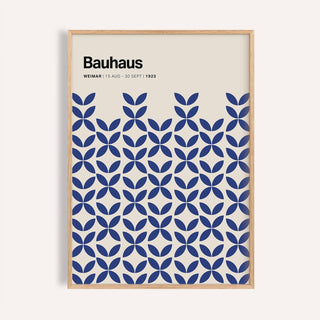 Framed print of a blue geometric bauhaus pattern with text on cream background