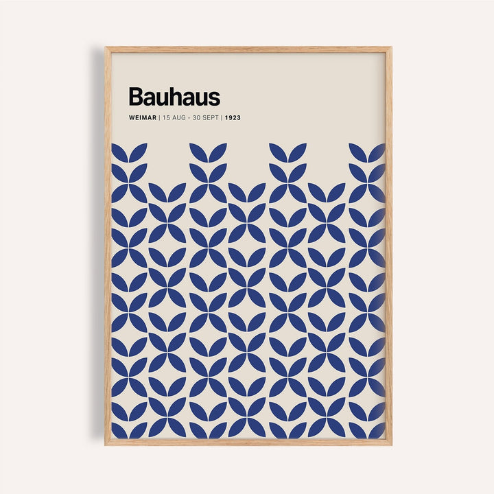 Framed print of a blue geometric bauhaus pattern with text on cream background