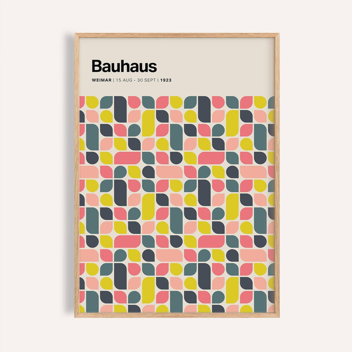 Framed print close-up of colorful Bauhaus geometric block pattern with yellow pink and dark grey