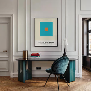 Wall Office Art of orange and blue squares above a teal desk with a chair and lamp