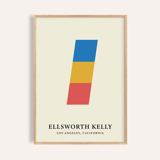 Framed print of minimalist abstract stacked blocks in blue, yellow and red with text below