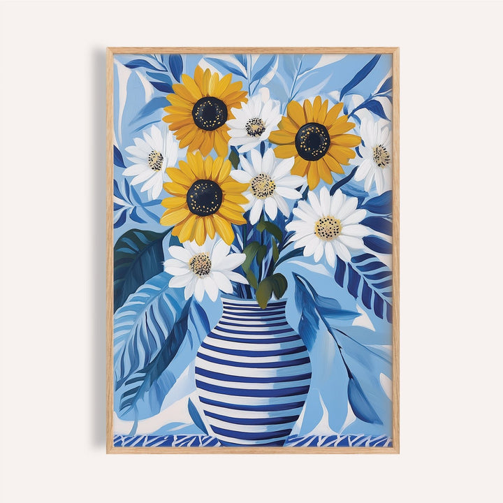Art of Sunflowers wall art showing sunflowers and daisies in a blue and white striped vase with blue leaves