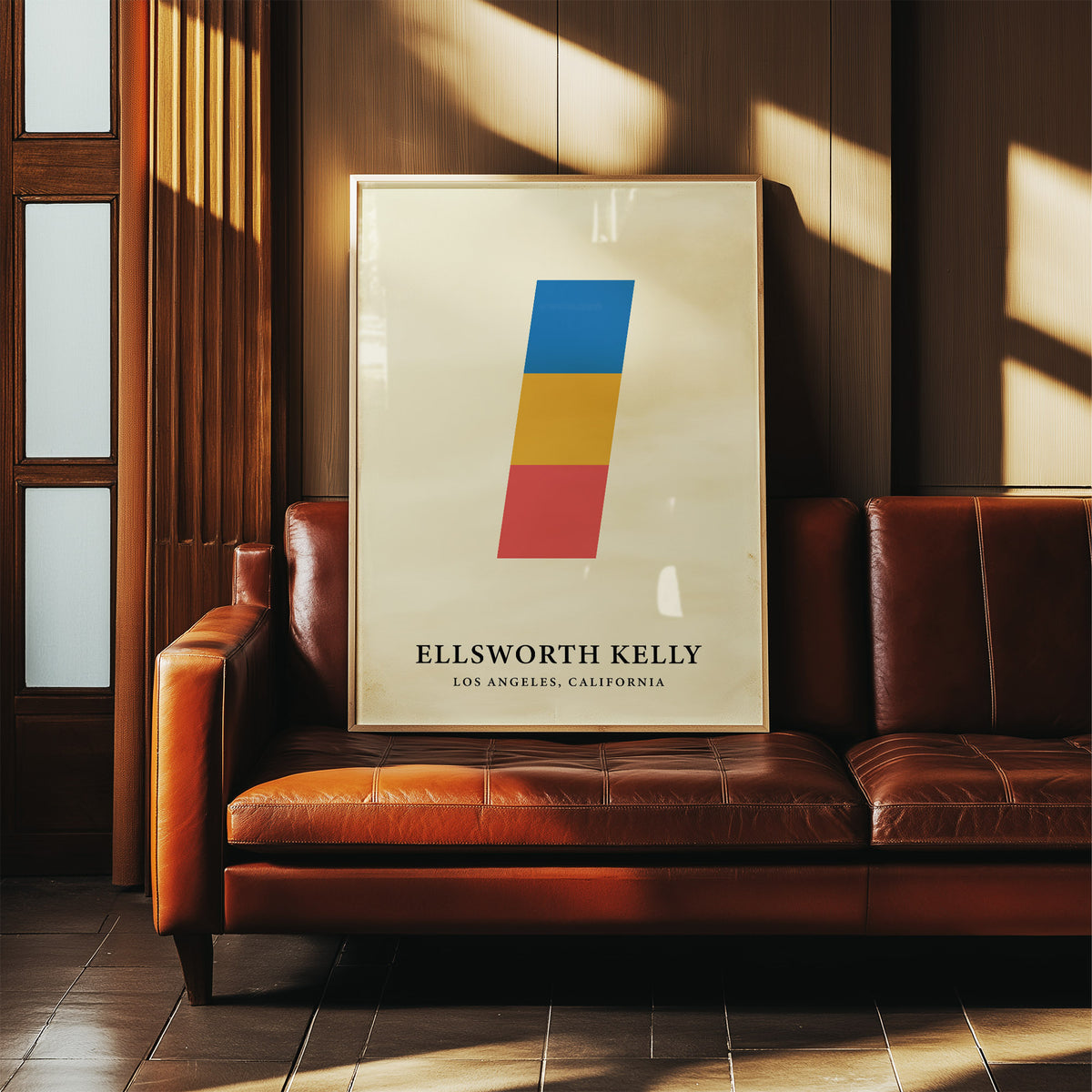 Creative wall art of stacked coloured blocks leaning on a brown leather sofa in a wood panel room