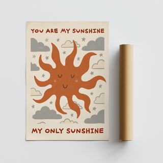 Sunshine Quote Wall Art with a smiling sun illustration in terracotta red and grey next to a packaging tube