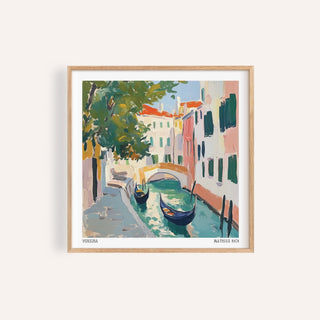 Framed print of Venice wall art showing gondolas on a canal with pastel buildings and a tree